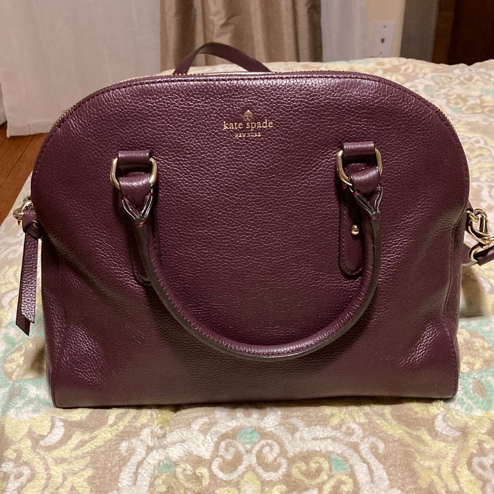 Kate Spade all leather purse with shoulder strap.